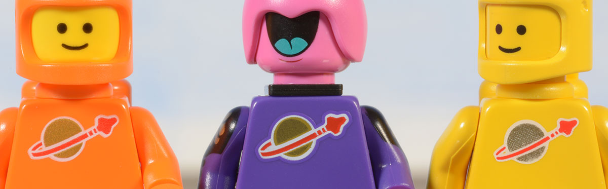 classic space logos on three different minifigure torsos